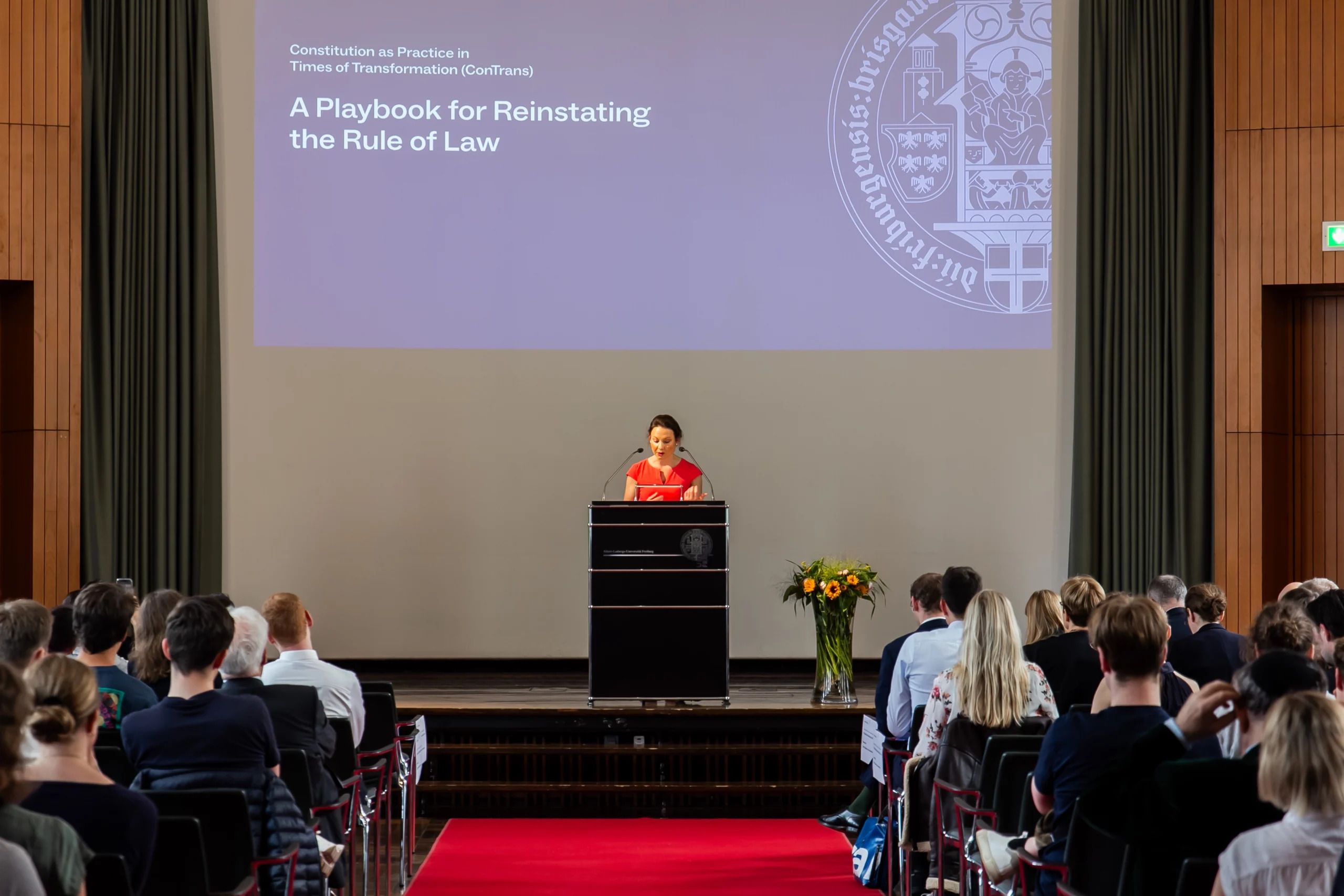 A photo of a speaker at the conference