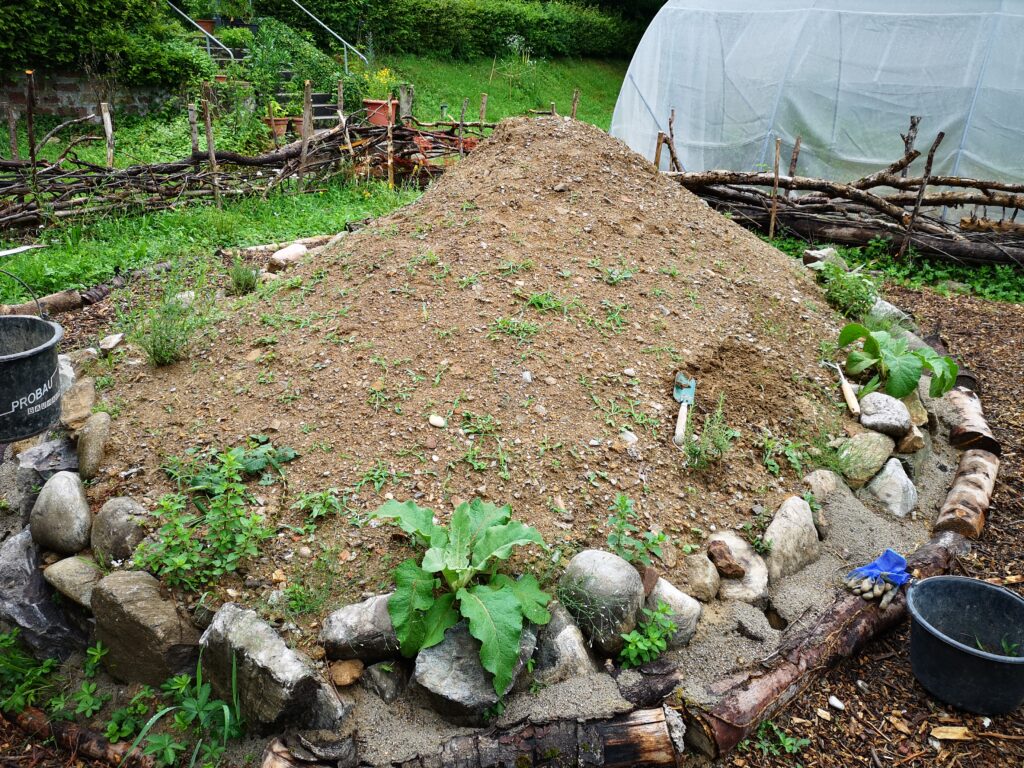 Nesting mound made of earth set in thick stones