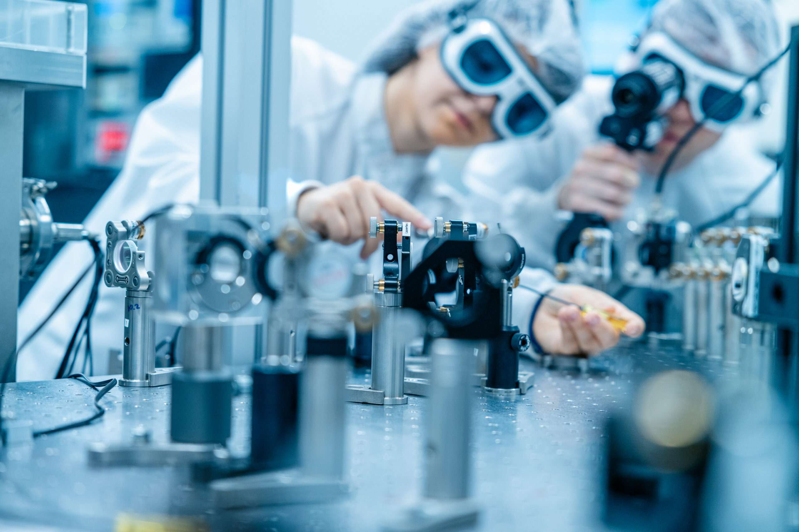 People with Laser in a Physics Laboratory