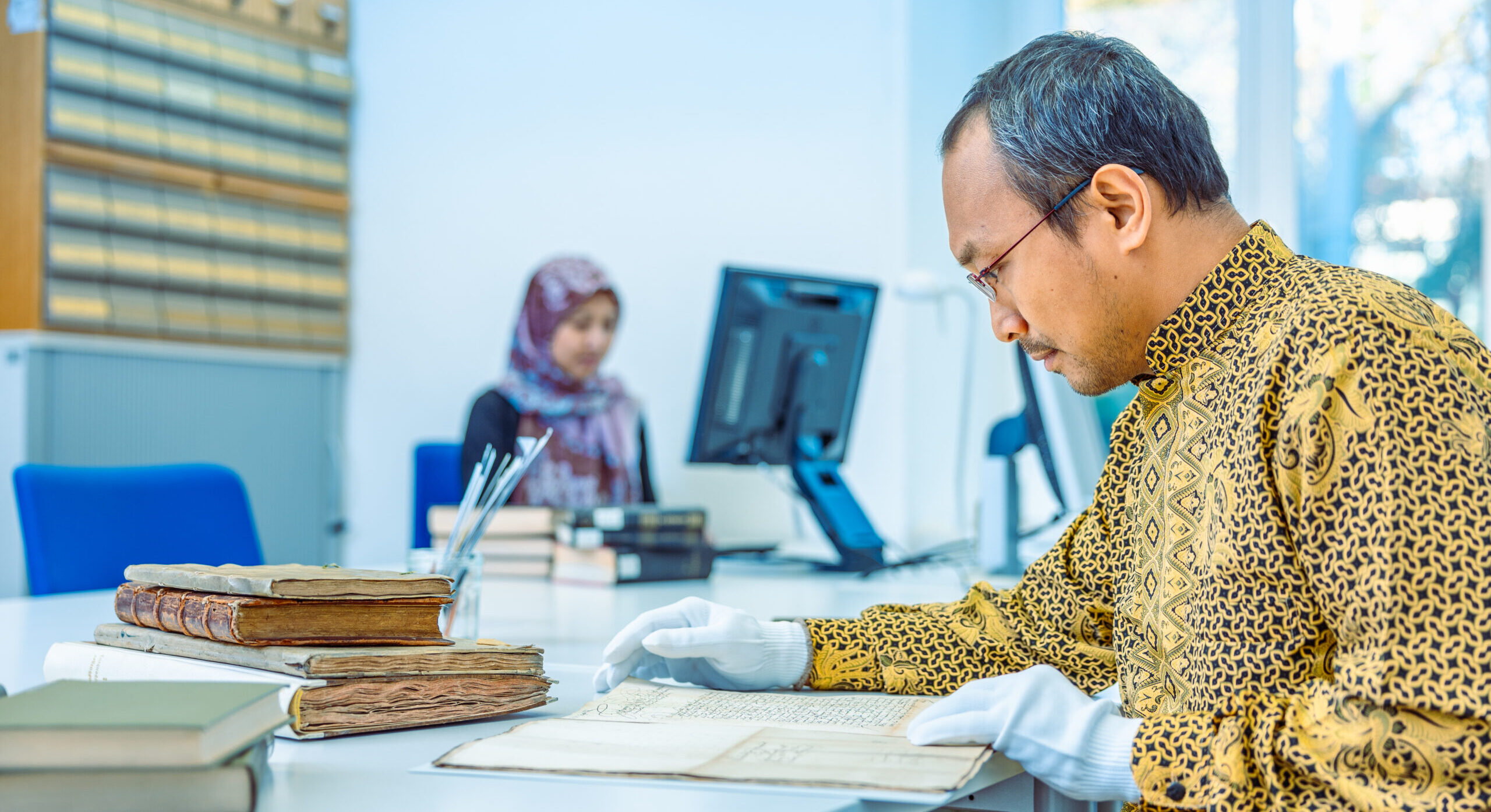 Scholar in Archive doing research