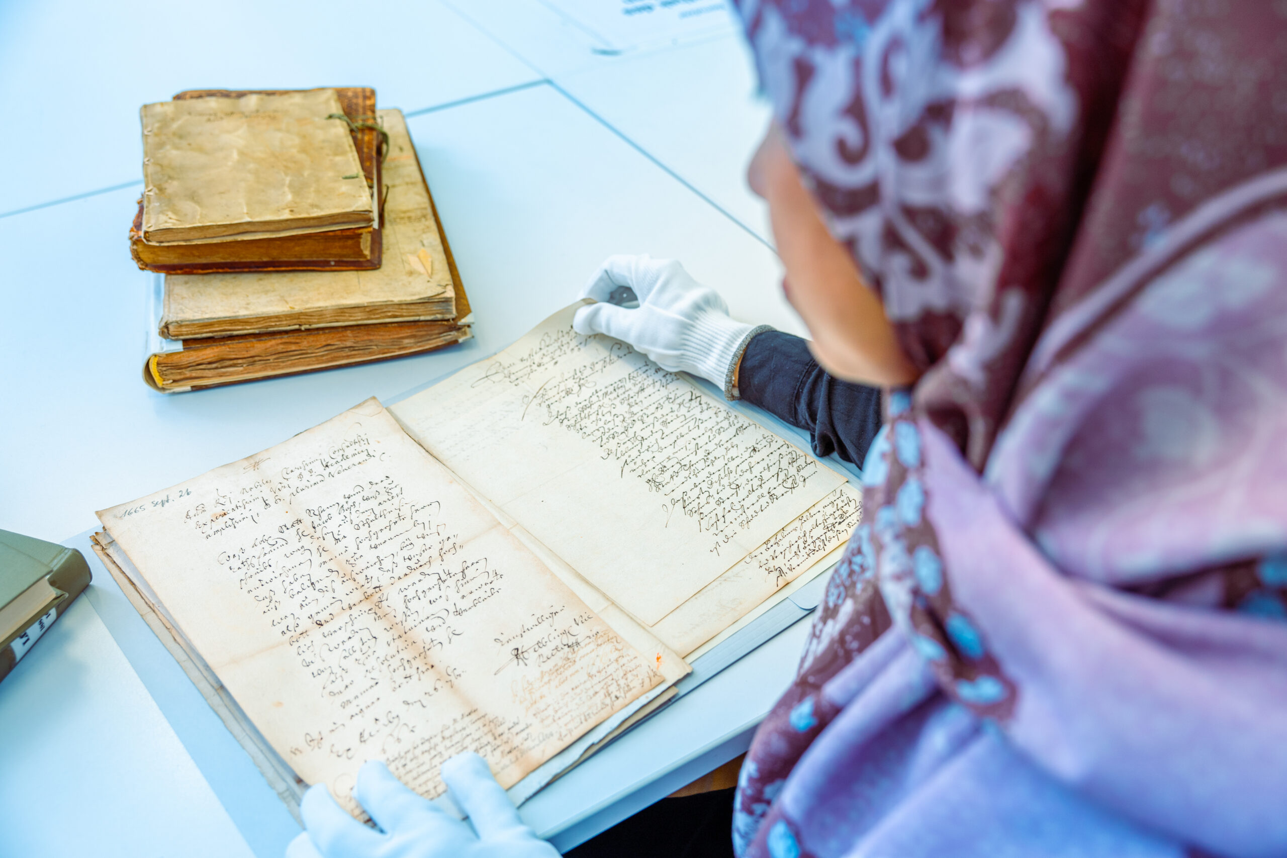 Female Scholar doing research in an archive