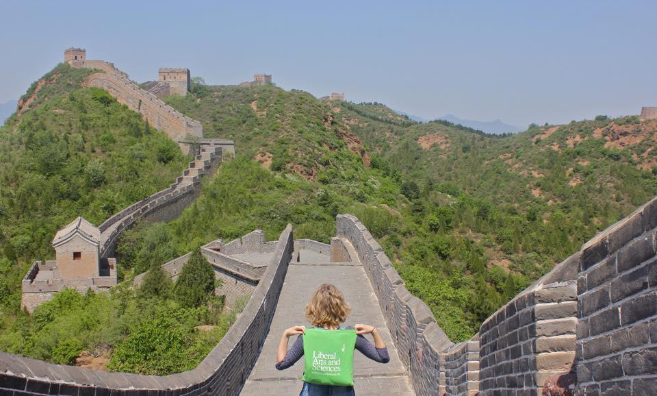 LAS student with a green LAS bag on the Great Wall.