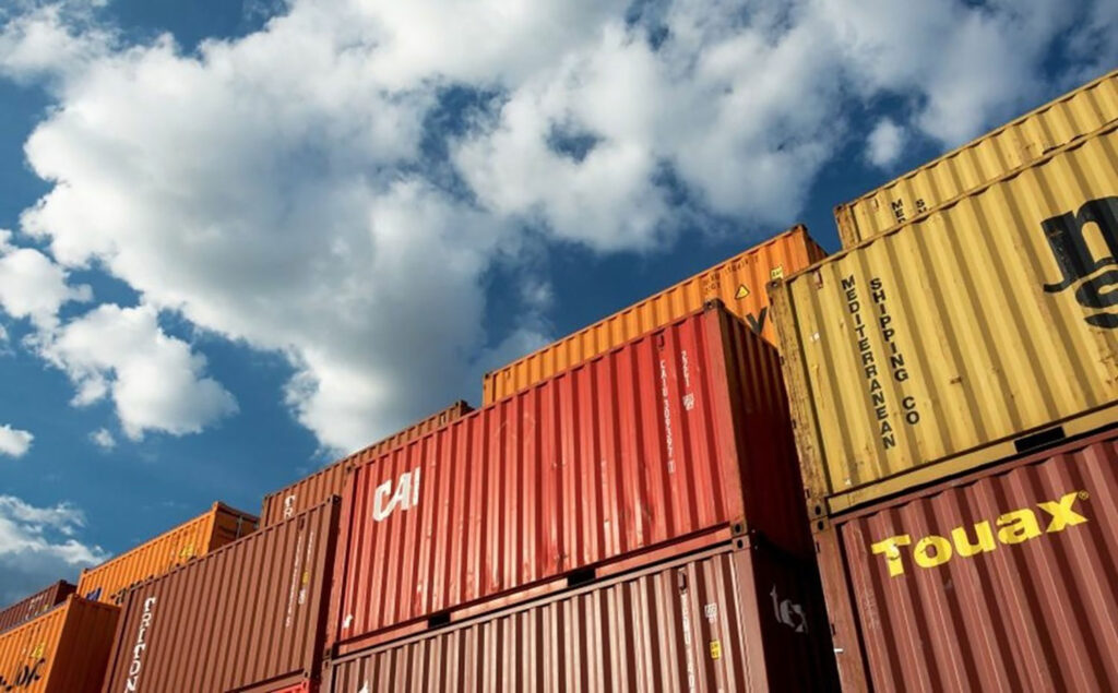 Shipping containers and a blue sky with clouds