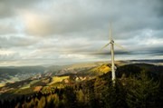 Wind turbine in a forested hill