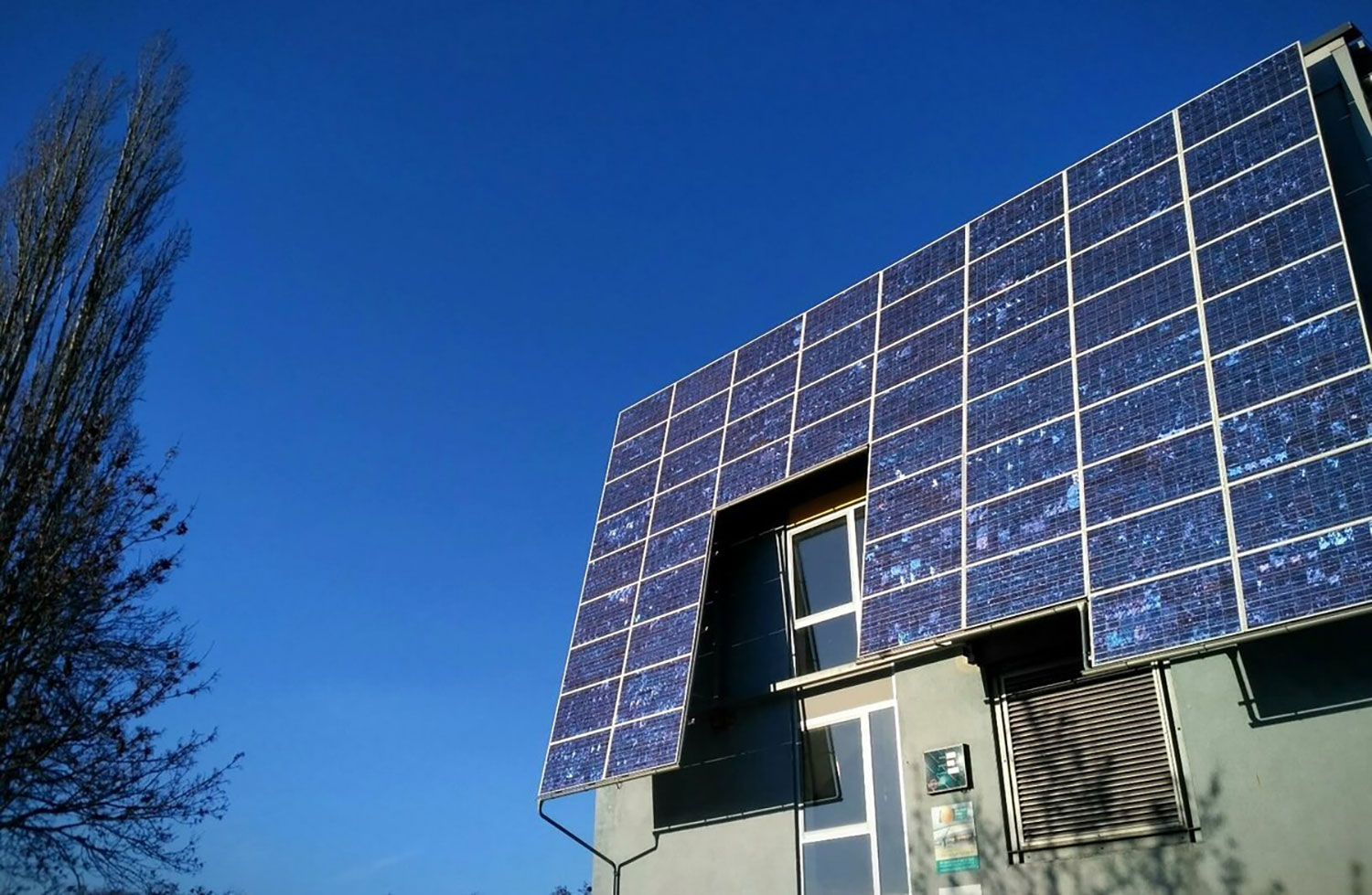 A house with the roof covered with solar panels