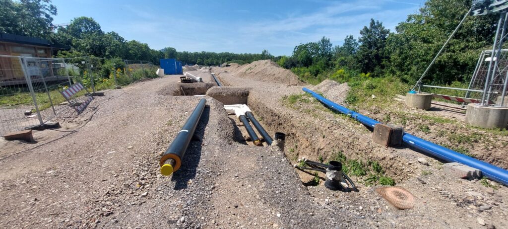 Construction site with tubes being installed underground